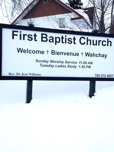 A photo of the welcome sign of First Baptist Church Cochrane. Key features to note include the service times - Sunday at 11 am and Women's Bible Study Tuesday (now Wednesday) at 1 pm.